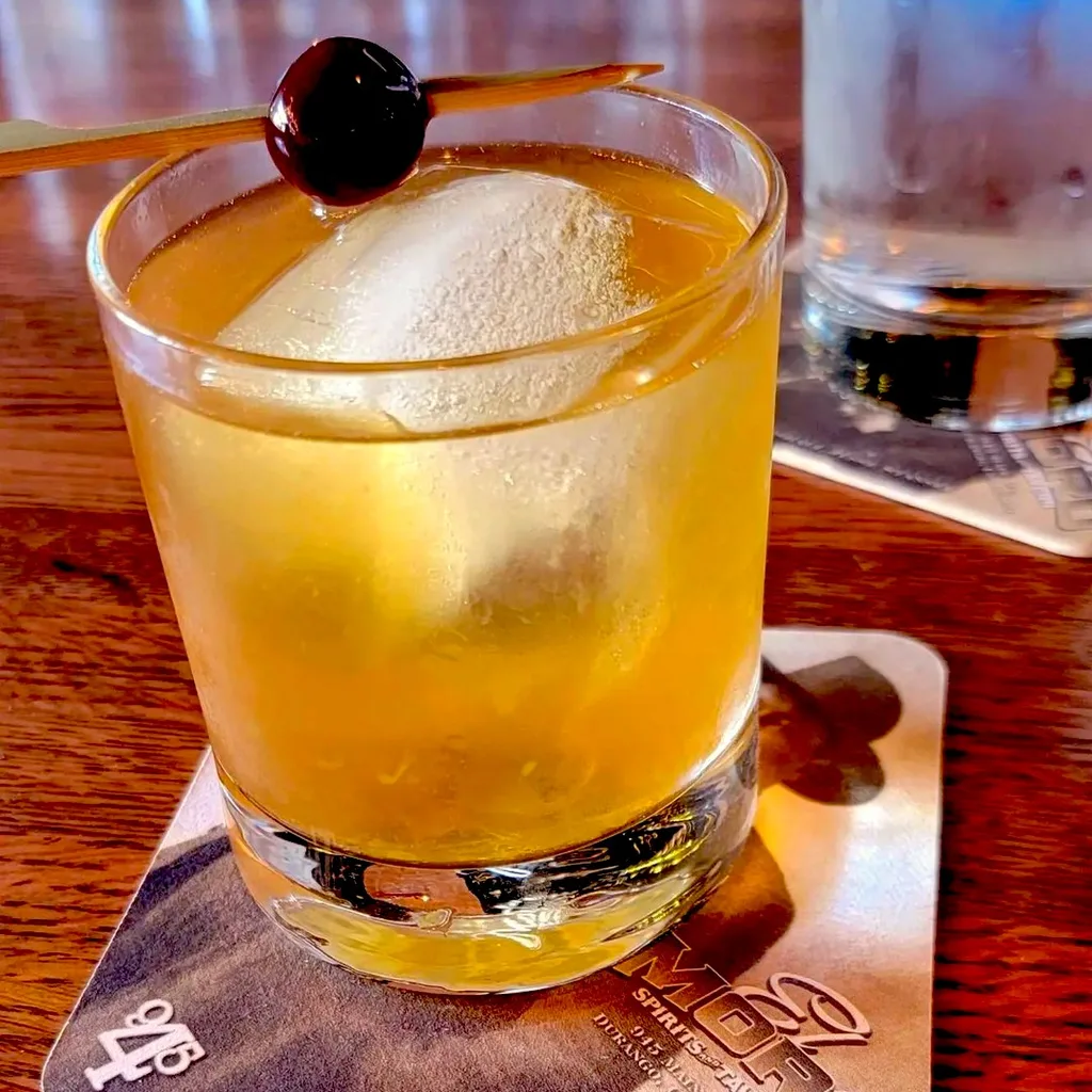 Bartender selecting from the spirits library